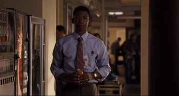 Movie still from “The Front Runner” (2018), directed by Jason Reitman – A man holding a glass of juice in a room; Medium shot, Over the shoulder angle