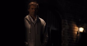 Movie still from “The Front Runner” (2018), directed by Jason Reitman – A man standing in the dark with his hands in his pockets; Medium shot, Low angle