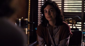 Movie still from “The Front Runner” (2018), directed by Jason Reitman – A woman sitting at a table in front of a window; Medium shot, Over the shoulder angle