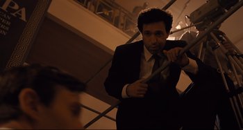 Movie still from “The Front Runner” (2018), directed by Jason Reitman – A man in a suit and tie holding a tie; Medium shot, Low angle