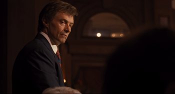 Movie still from “The Front Runner” (2018), directed by Jason Reitman – A person wearing a suit and tie; Close Up shot, Over the shoulder angle
