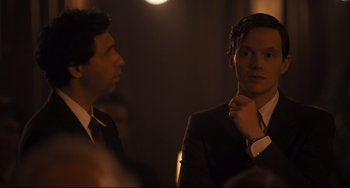 Movie still from “The Front Runner” (2018), directed by Jason Reitman – A man in a suit standing next to another man in a suit; Medium shot, Over the shoulder angle