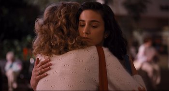 Movie still from “The Front Runner” (2018), directed by Jason Reitman – Two women are hugging each other in the street; Close Up shot, Over the shoulder angle