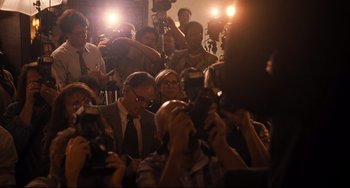 Movie still from “The Front Runner” (2018), directed by Jason Reitman – A group of people taking pictures with cameras; Wide shot, High angle