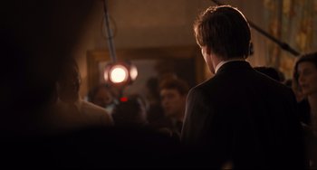 Movie still from “The Front Runner” (2018), directed by Jason Reitman – A group of people in a room with a mirror; Medium shot, Over the shoulder angle