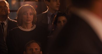 Movie still from “The Front Runner” (2018), directed by Jason Reitman – A group of people standing around each other; Medium shot, Over the shoulder angle