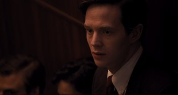 Movie still from “The Front Runner” (2018), directed by Jason Reitman – A man wearing a suit and tie looking to his left; Close Up shot, High angle