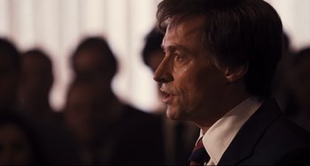 Movie still from “The Front Runner” (2018), directed by Jason Reitman – A person wearing a suit and tie; Close Up shot, Over the shoulder angle