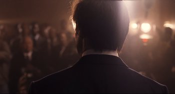 Movie still from “The Front Runner” (2018), directed by Jason Reitman – The back of a man's head in a dark room; Close Up shot, Low angle