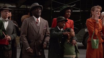 Movie still from “Cool World” (1992), directed by Ralph Bakshi – An older man and a young man and a young girl; Medium shot, Low angle