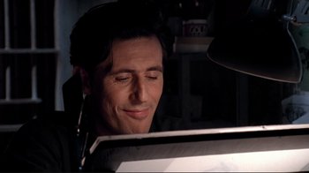 Movie still from “Cool World” (1992), directed by Ralph Bakshi – A person using a computer; Close Up shot, Low angle