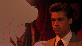 Movie still from “Cool World” (1992), directed by Ralph Bakshi – A man in a suit and tie next to an animated character; Close Up shot, Over the shoulder angle