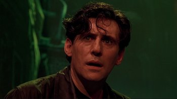 Movie still from “Cool World” (1992), directed by Ralph Bakshi – A person wearing a brown shirt; Close Up shot, Low angle