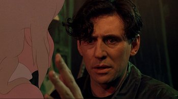 Movie still from “Cool World” (1992), directed by Ralph Bakshi – A person holding his hand up; Close Up shot, Over the shoulder angle