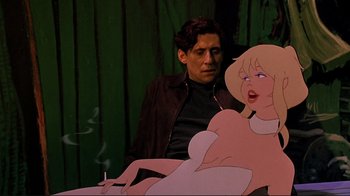 Movie still from “Cool World” (1992), directed by Ralph Bakshi – A man sitting next to an animated woman smoking a cigarette; Medium shot, Low angle