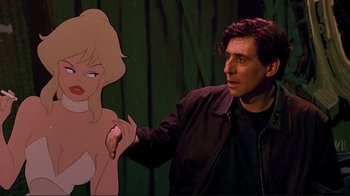 Movie still from “Cool World” (1992), directed by Ralph Bakshi – A man standing in front of a cartoon of a woman; Medium shot, Low angle