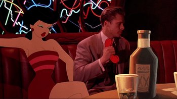 Movie still from “Cool World” (1992), directed by Ralph Bakshi – A man sitting in front of a woman holding a pair of sunglasses; Medium shot, Low angle