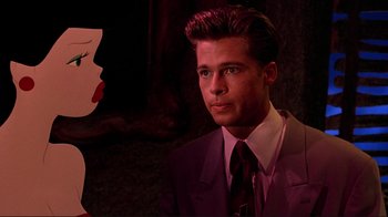 Movie still from “Cool World” (1992), directed by Ralph Bakshi – A man in a suit and tie next to a woman in a purple dress; Close Up shot, Over the shoulder angle