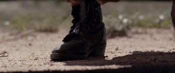Movie still from “Cop Car” (2015), directed by Jon Watts – A person wearing a black boot; Extreme Close Up shot, Low angle