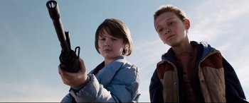 Movie still from “Cop Car” (2015), directed by Jon Watts – Two young boys standing next to each other; Close Up shot, Low angle