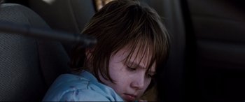 Movie still from “Cop Car” (2015), directed by Jon Watts – A child with a hair brush; Close Up shot, Low angle