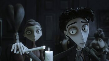 Movie still from “Corpse Bride” (2005), directed by Tim Burton – A couple of people standing next to some candles; Medium shot, Over the shoulder angle