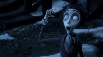 Movie still from “Corpse Bride” (2005), directed by Tim Burton – The corpse bride is holding a knife in her hand; Close Up shot, High angle