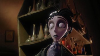 Movie still from “Corpse Bride” (2005), directed by Tim Burton – The head of a doll in a room; Close Up shot, Low angle