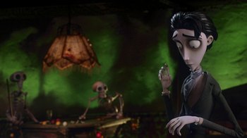 Movie still from “Corpse Bride” (2005), directed by Tim Burton – A couple of people that are sitting in a room together; Medium shot, Over the shoulder angle