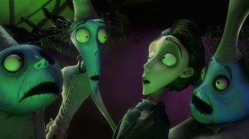 Movie still from “Corpse Bride” (2005), directed by Tim Burton – A couple of people standing next to each other in a room; Medium shot, Low angle