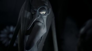 Movie still from “Corpse Bride” (2005), directed by Tim Burton – The face of an evil looking character; Close Up shot, Low angle