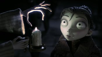 Movie still from “Corpse Bride” (2005), directed by Tim Burton – A candle and a doll head; Close Up shot, Over the shoulder angle
