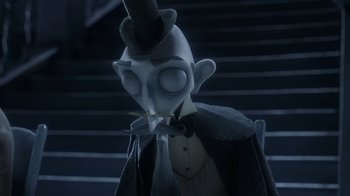 Movie still from “Corpse Bride” (2005), directed by Tim Burton – A person wearing a top hat; Close Up shot, Low angle