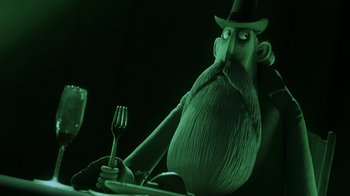 Movie still from “Corpse Bride” (2005), directed by Tim Burton – A man with a long beard holding a fork in a dark room; Medium shot, Over the shoulder angle