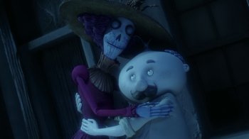 Movie still from “Corpse Bride” (2005), directed by Tim Burton – A couple of cartoon characters hugging each other; Medium shot, Low angle