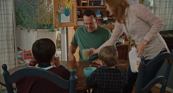 Movie still from “Couples Retreat” (2009), directed by Peter Billingsley – A group of people sitting around a table; Medium shot, Over the shoulder angle