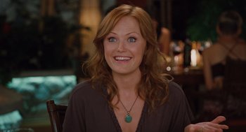 Movie still from “Couples Retreat” (2009), directed by Peter Billingsley – A person sitting at a table; Close Up shot, Over the shoulder angle