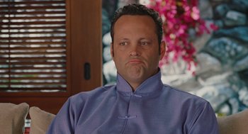 Movie still from “Couples Retreat” (2009), directed by Peter Billingsley – A person wearing a blue shirt; Close Up shot, Low angle
