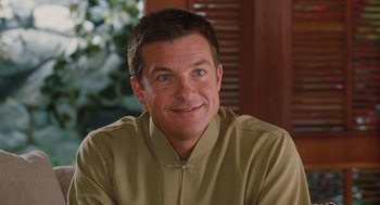 Movie still from “Couples Retreat” (2009), directed by Peter Billingsley – A person wearing a shirt; Close Up shot, Over the shoulder angle