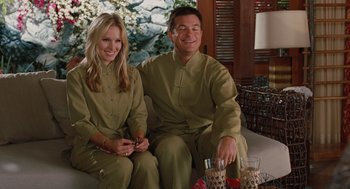 Movie still from “Couples Retreat” (2009), directed by Peter Billingsley – A man and a woman sitting next to each other; Medium shot, High angle