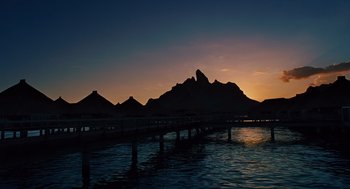 Movie still from “Couples Retreat” (2009), directed by Peter Billingsley – A body of water that has a pier in it; Extreme Wide shot, Low angle