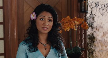 Movie still from “Couples Retreat” (2009), directed by Peter Billingsley – A woman with a flower in her hair; Close Up shot, Over the shoulder angle