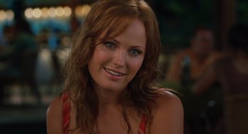 Movie still from “Couples Retreat” (2009), directed by Peter Billingsley – A person with long red hair; Close Up shot, Over the shoulder angle