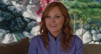 Movie still from “Couples Retreat” (2009), directed by Peter Billingsley – A woman with red hair wearing a blue shirt; Close Up shot, Over the shoulder angle