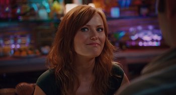 Movie still from “Couples Retreat” (2009), directed by Peter Billingsley – A person with long red hair; Close Up shot, Over the shoulder angle