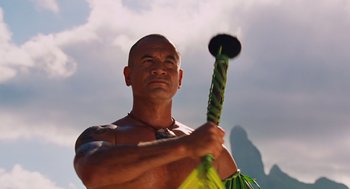 Movie still from “Couples Retreat” (2009), directed by Peter Billingsley – A man holding a spear in his hands; Close Up shot, Low angle