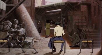 Movie still from “Cowboy Bebop: The Movie” (2001), directed by Yoshiyuki Takei – An animated scene of a man sitting on a chair in an industrial setting; Wide shot, High angle