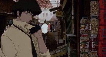 Movie still from “Cowboy Bebop: The Movie” (2001), directed by Yoshiyuki Takei – A group of people walking down a street; Medium shot, Low angle