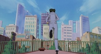 Movie still from “Cowboy Bebop: The Movie” (2001), directed by Yoshiyuki Takei – A man is walking on a balcony in a city; Wide shot, Low angle