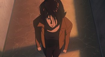 Movie still from “Cowboy Bebop: The Movie” (2001), directed by Yoshiyuki Takei – An animated woman with long black hair in a brown jacket; Medium shot, Low angle